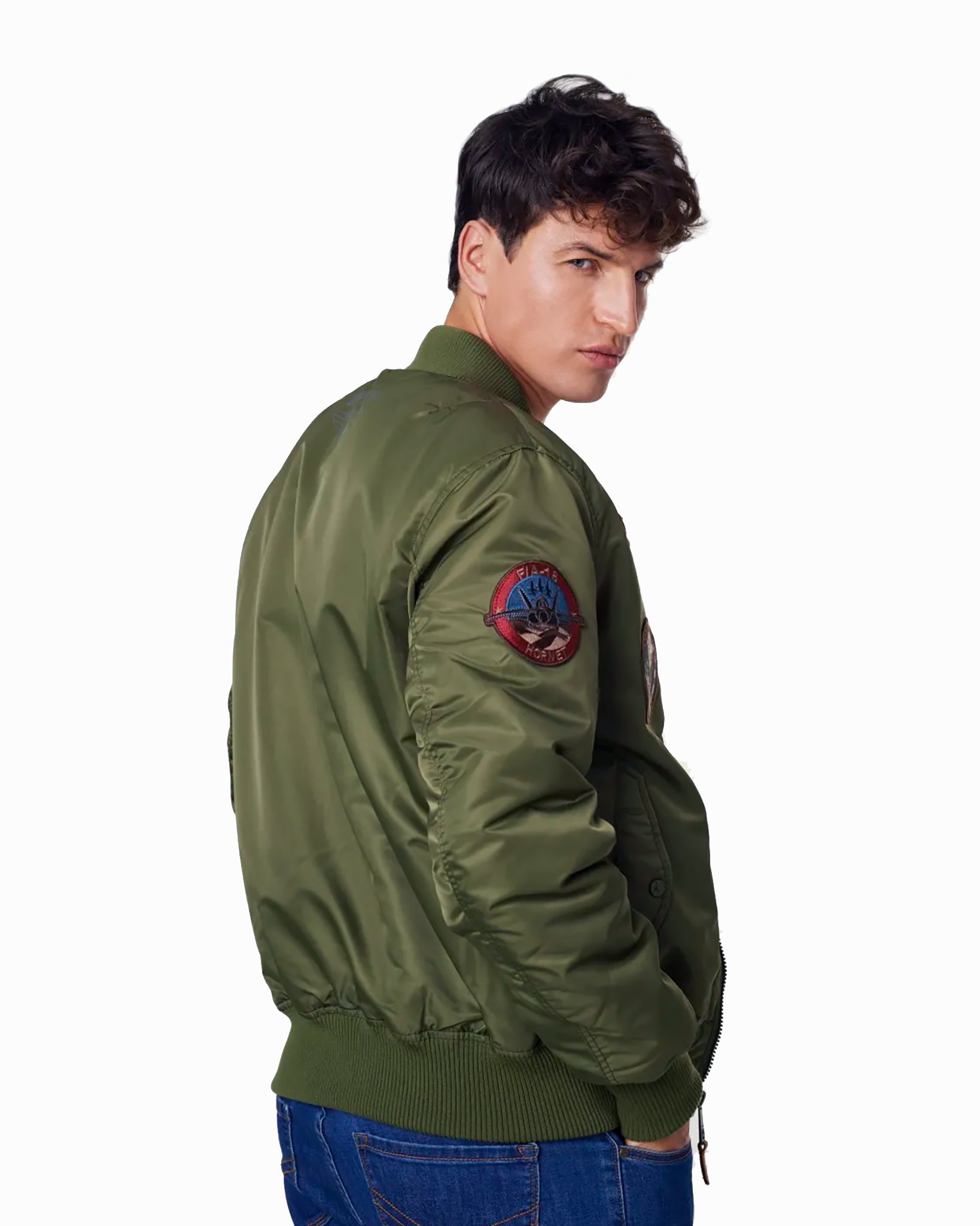 Man modeling the green variant of the Top Gun® MA-1 bomber jacket #color_olive